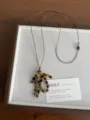 Close-up detail of retro natural stone grape cluster necklace with adjustable brown leather cord. - Tiger Eye Grape Cluster Style (XL5713C)