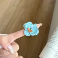 Detailed shot of a blue polka dot flower enamel ring, handmade metal open ring for women. - Blue Polka Dot Flower (JZ1068C)
