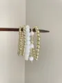 Detailed view of vintage multi-layer stacked beaded bracelets with gold and white beads. - Style D Gold White Beaded Retro (SL0725)