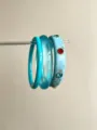 Detailed close-up of fashionable layered resin bangles, featuring marble pattern and rhinestones. - Rhinestone Transparent Bracelet Set (SL0676B)