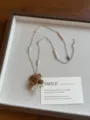 Brown flocked bear necklace detail view with pearl beading and stylish long sweater chain. - Pearl Bowknot Bear Style (XL5056)