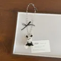 Exquisite beaded rabbit necklace detail showing white and black pearls with elegant black bow. - Black Rabbit Style (XL4960A)