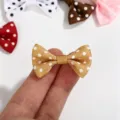 Detail of a mini gold polka dot grosgrain ribbon bow for DIY hair and doll crafts - Polka Dot Bow / Khaki