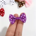 Macro view of a small purple polka dot grosgrain ribbon bow for DIY accessories - Polka Dot Bow / Purple
