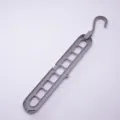 Durable grey 9-hole space-saving magic clothes hanger with a 360-degree rotatable hook - 400 Pieces/Pack / Gray
