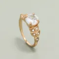Gold plated simulated diamond engagement ring with a brilliant centerpiece and leaf side stones. - White 17# KC Gold Plated M200