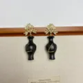 Retro European black vase earrings with gold floral top and glitter detail, stylish fashion jewelry. - Gold Vase Style (EH2644A)