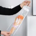 Ramo de flores de ganchillo hecho a mano en bolsa transparente con papel y cinta. - Clavel Naranja