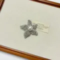 Close up detail of the exquisite rhinestone and pearl star brooch, sparkling crystal metal design. - Silver Star Brooch (XZ0158B)