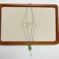 Exquisite niche design green apple pendant necklace, multi-layer pearl star tassel chain. - Layered Green Apple Necklace Style (XL3984)