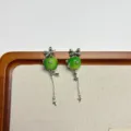 Charming green apple drop earrings with silver bow and star chain tassel design details. - Bow Knot Apple Earrings Style (EH2622)