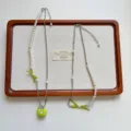 Niche design green apple pendant necklace, stylish layered pearl and beaded bow long clavicle chain. - Beaded Layered Green Apple Necklace Style (XL4280)