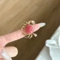Close-up detail of a creative ocean style crab ring with gold metal and red shell design. - Red Crab Sea Snail Texture Style (JZ0918)