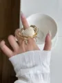 Detailed shot of golden crab ring featuring a natural seashell and open metal band. - White Crab Individual Shape Style (JZ0837)