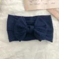 Soft navy blue elastic baby headband featuring a large cable knit decorative bow - Twisted Bowknot Style / Dark Blue