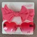 Süßes Set aus rosa Kinderhaarreif mit Schleife und herzförmiger Jelly-Sonnenbrille - Stirnband- und Brillenset / Verlauf Rosa