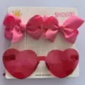 Rosa Schleifen-Haarspangen und herzförmige Jelly-Sonnenbrille für Mädchen im Set - Set aus Haarspange und Sonnenbrille / Rosa