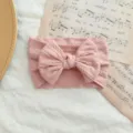 Diadema rosa de punto trenzado con lazo de nailon elástico para bebé - Estilo de Lazo Torcido / Rosa