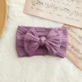 Diadema para bebé en color morado con trenzado y lazo grande de nailon elástico suave - Estilo de Lazo Torcido / Púrpura