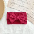 Diadema elástica para bebé de punto acanalado rosa oscuro con un lazo grande detalle - Estilo de Lazo Torcido / Rosa oscuro