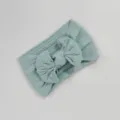 Diadema elástica de punto trenzado para bebé con un lazo decorativo en azul menta - Estilo de Lazo Torcido / Azul Menta