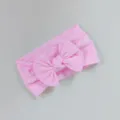 Banda para bebé elástica rosa de nailon con un gran lazo decorativo tejido - Estilo de Lazo Torcido / Rosa