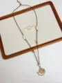 Detail view of boho shell pendant necklace with adjustable brown cord and beaded accents. - Small Snail Style (XL3201A)