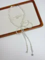 Detailed closeup of the elegant pearl bow necklace with star pendants, vintage style jewelry piece. - White Pearl Bow Style (XL3049A)