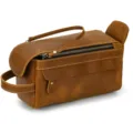 Detailed close-up of retro brown crazy horse leather toiletry bag with metal zipper and handle. - Brown