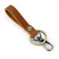 Detail view of vintage crazy horse leather keychain with bronze metal ring and clasp. - 1050 Style / Tan