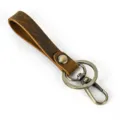 Detailed shot of vintage crazy horse leather keychain with durable metal clasp and ring. - 1050 Style / Brown