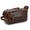 Close-up detail of vintage genuine leather toiletry bag showing fine stitching and zipper. - Patterned Premium Leather