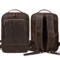 Detail view of the vintage genuine leather backpack showing front and back texture and sturdy zippers. - Mesh Backing / Dark Brown