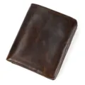 Close-up view of the dark brown leather wallet showing vintage texture and fine stitch details. - Coffee