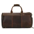 Detailed view of genuine leather vintage travel duffel bag with durable zipper and handles. - Brown