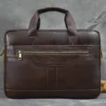 Dark brown leather briefcase detail, business laptop bag handle and metal zipper accent. - 3317 / Coffee
