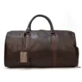 Detail view of brown leather travel duffel bag for men, spacious gym and business luggage - Classic / Coffee