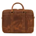Brown leather briefcase closeup showing cowhide texture, dual handles and metal hardware. - Business Style (3823) / Brown