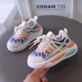 Breathable mesh toddler sneakers with vibrant rainbow colors and comfortable sole. - White