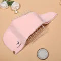 Detail view of soft pink coral fleece dry hair cap with cute whale embroidery and button fastener. - Pink