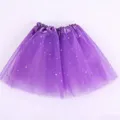 Details of the purple girls tutu skirt featuring layers of tulle and shiny silver star sequins. - 30cm / Purple