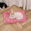 Close-up detail of the thick flannel pet mat with cute colorful paw print design for cozy warmth. - Rose Red Paws