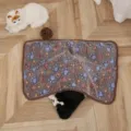 Coral velvet pet blanket detail showing soft paw print fabric pattern and cozy cat mat texture. - Coffee Color Paws