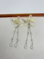 Elegant beaded flower long tassel earrings, white seed bead floral design with silver chains. - Cream White Flower Earrings