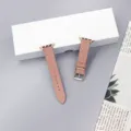 Quilted cowhide leather watch strap detail view featuring elegant rose gold buckle. - Pink