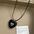 Black heart pendant necklace with black cord and descriptive card for daily fashion wear. - Black Heart Pendant Style (XL0920A)