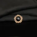Close up detail of round alloy rhinestone black gemstone flower button for DIY crafts decoration. - Black