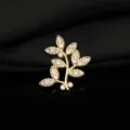 Dettaglio accessorio per gioielli in lega con foglia di albero strass oro, ideale per fai da te. - Lato Destro / oro kc