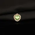 Close-up detail of a charming green heart rhinestone alloy pendant charm for DIY jewelry making. - Light Green