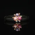 Close-up view of the tricolor pearl alloy flower hair accessory with fine sparkling rhinestones. - Floral Pearl Accessory / Multi-Color Three Pearls